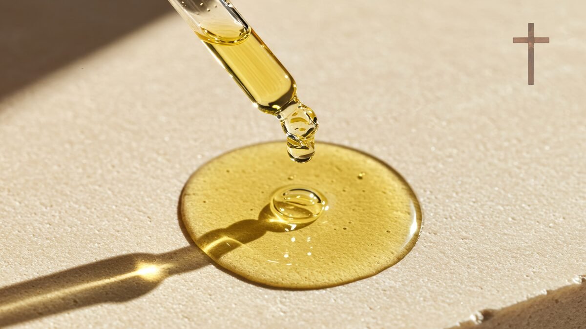 goutte d'huile petite croix dans le coin droit supérieur